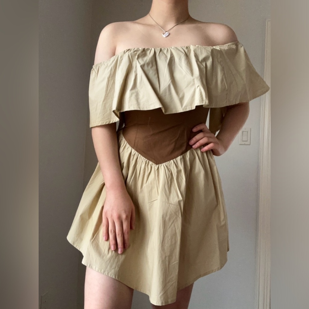 Tan and brown off the shoulder mini dress with a corseted waist.